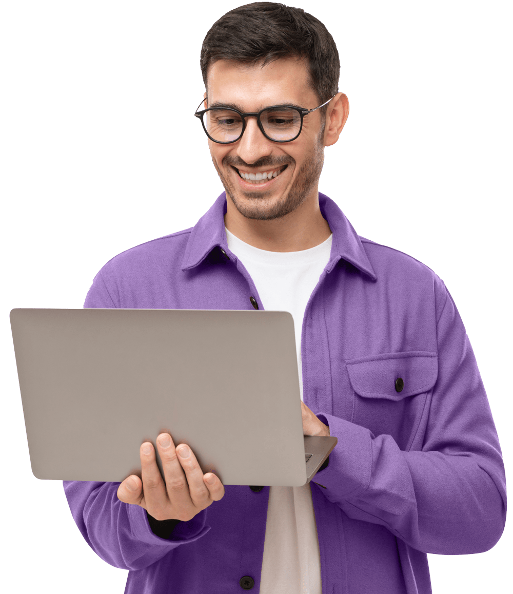 Happy man standing with opened laptop