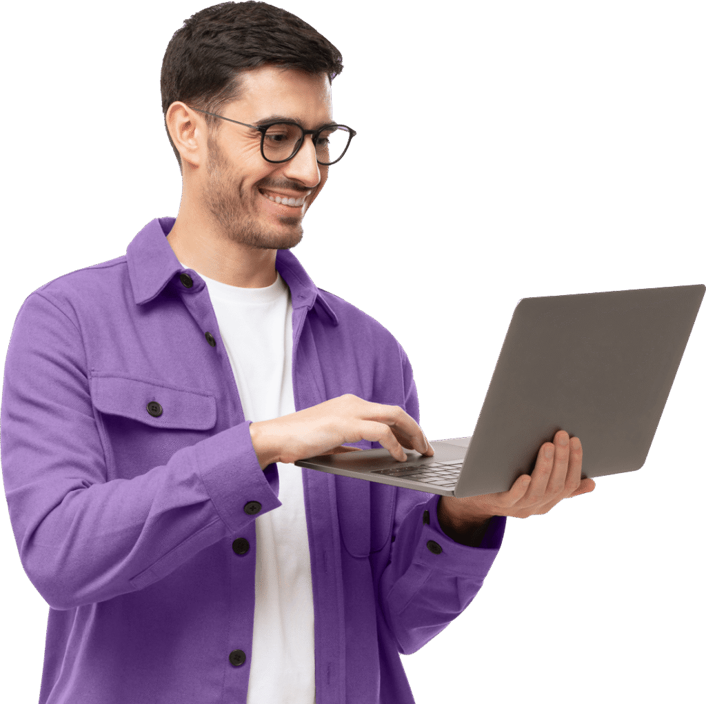 Man in a purple casual shirt using a laptop, representing digital marketing and local SEO services for businesses.