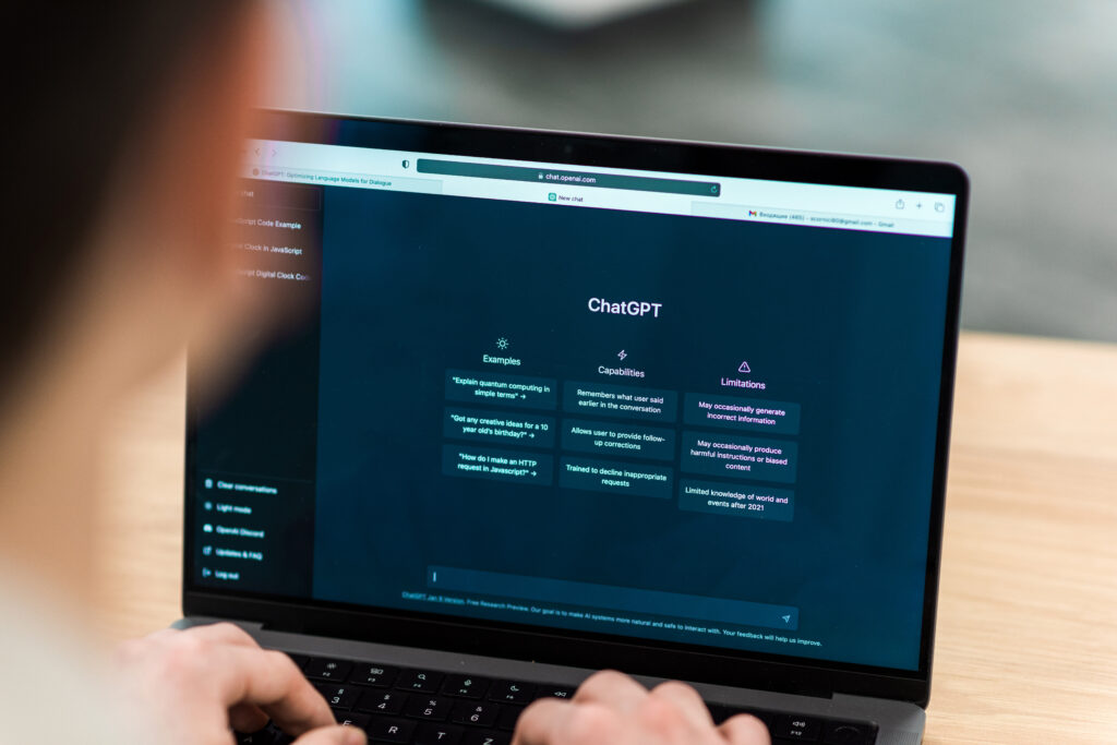 Person using a laptop displaying ChatGPT interface, illustrating AI-powered search and its impact on SEO strategies.
