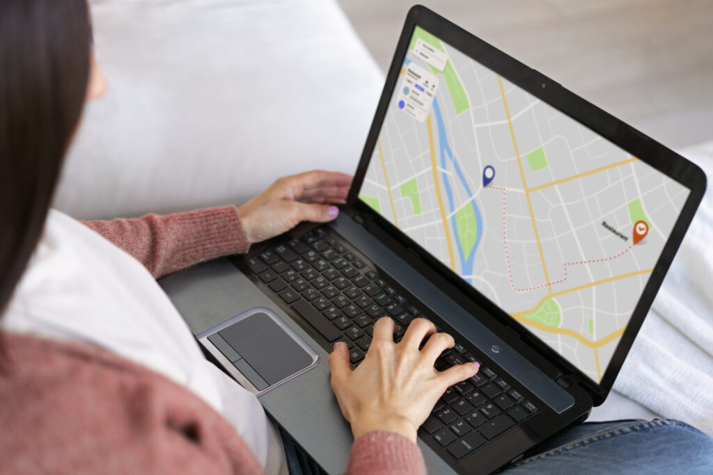 high angle woman holding laptop