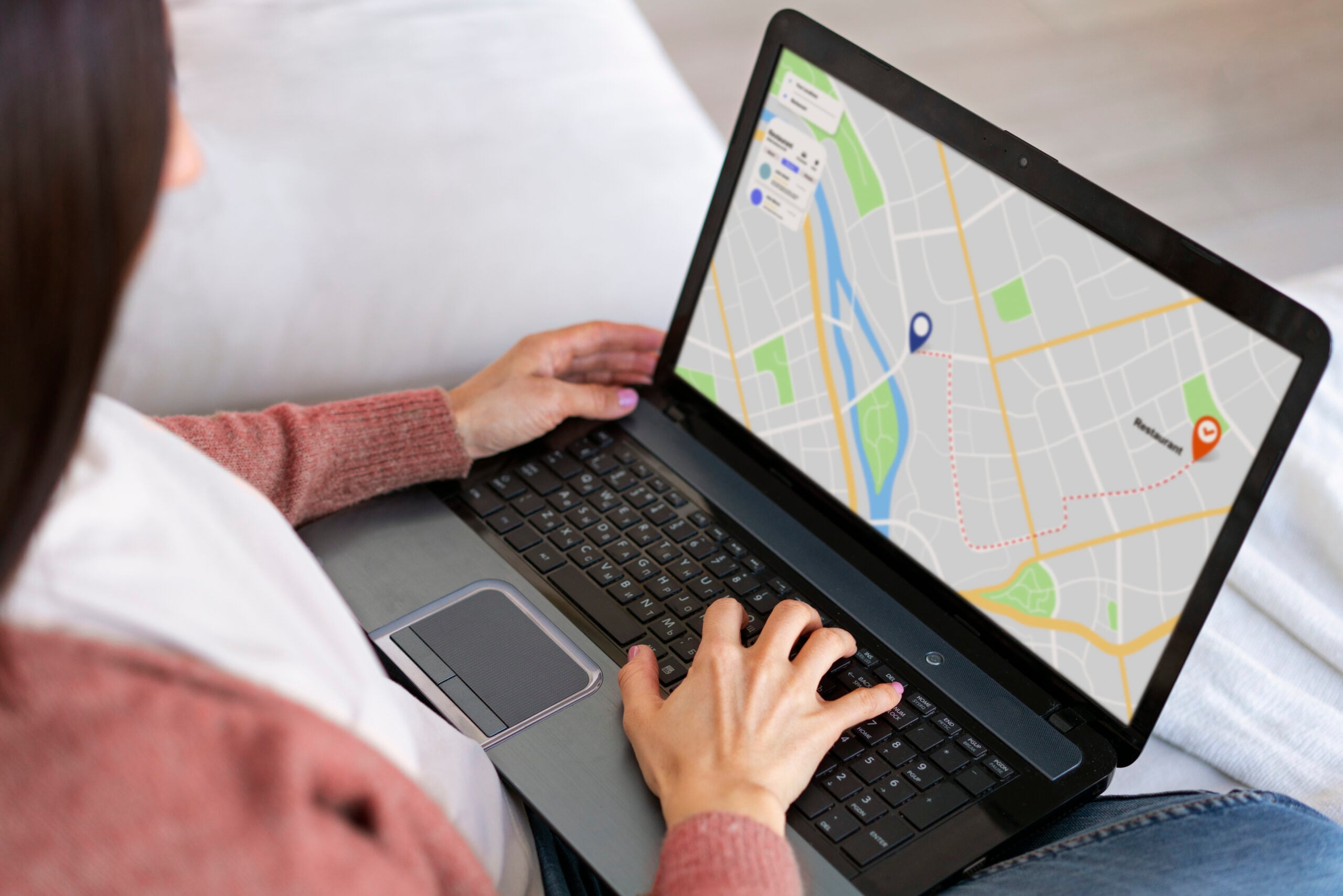 high angle woman holding laptop