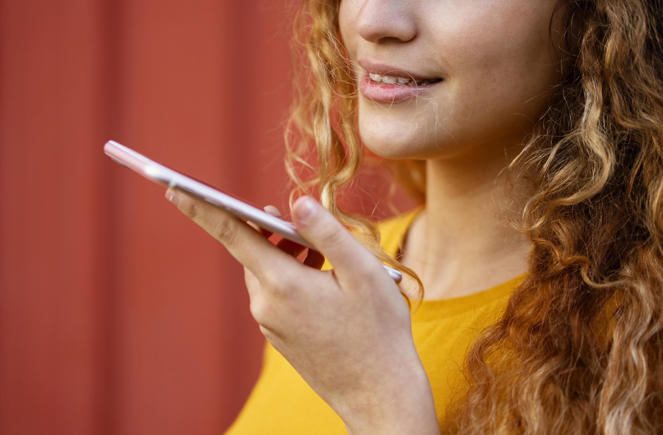 close up girl holding smartphone